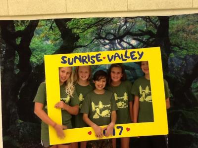 photo of students holding a SVES sign and posing for the photo booth