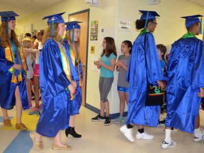 photo of South Lakes HS seniors walking in the hallway