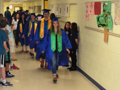 photo of South Lakes HS seniors walking in the hallway