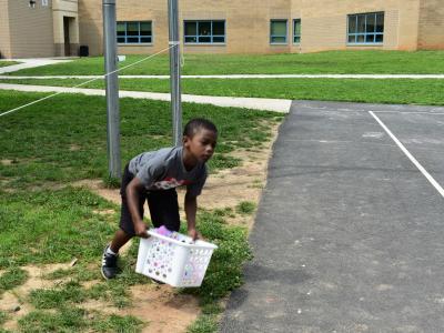 a photo of a student playing a relay game