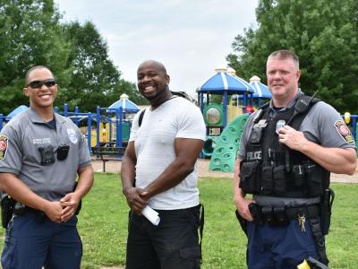 a photo of police officers and P.E. teacher